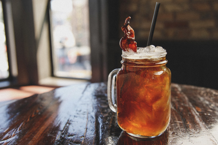 In Chicago, Rockit Burger Bar serves an unusually meaty drink. Combining spiced whiskey with Strongbow cider, Moose Drool brown ale, and Vermont maple syrup, the drink is garnished with a slice of bacon.