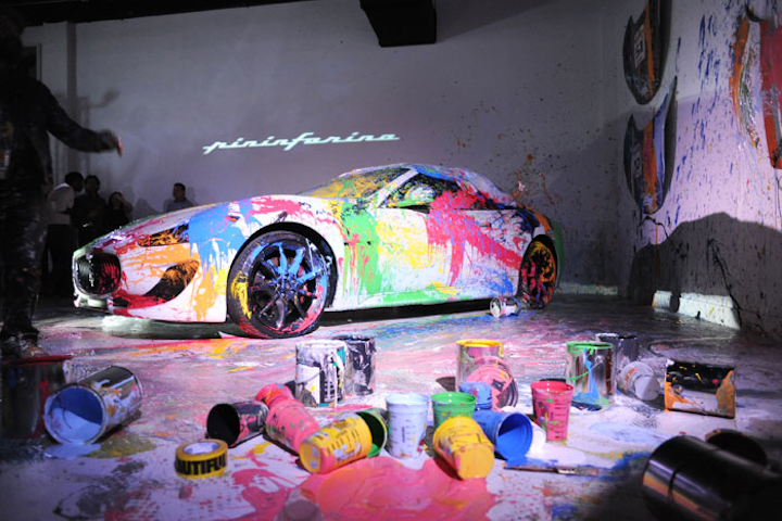 Street artist Mr. Brainwash painted a 2015 Maserati GranTurismo at the Art, Speed, and Design event hosted by Italian design house Pininfarina on December 6 at the luxury car showroom and art gallery Lou La Vie. Pininfarina is opening its first United States office in Miami and also used the event to show off its designs.