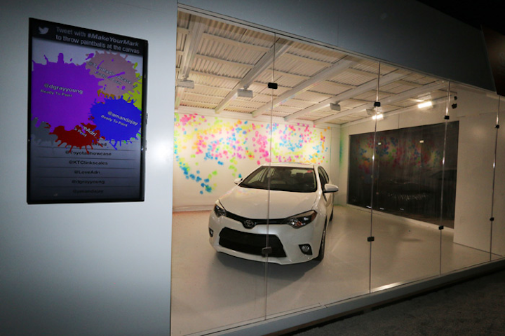 Cars also factored into the Revolt Blended Cultures event held December 6 at Miami's Brisky Gallery. Guests who tweeted with the #MakeYourMark hashtag would trigger a paintball that splattered onto a canvas behind a Toyota Corolla. A screen displayed the Twitter handle of the guest as the paintball fired.
