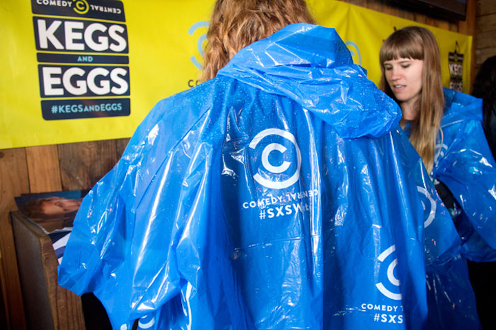 Ponchos were dispensed to passersby and attendees of Comedy Central’s one-day Kegs and Eggs at Pelons & Bar during the music segment of SXSW, just in time for the rain.