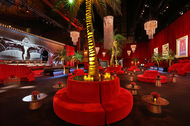 In a nod to Hollywood's golden age, the party space was given an opulent look, which included glittering chandeliers that hung overhead and gold-framed movie posters on the walls.