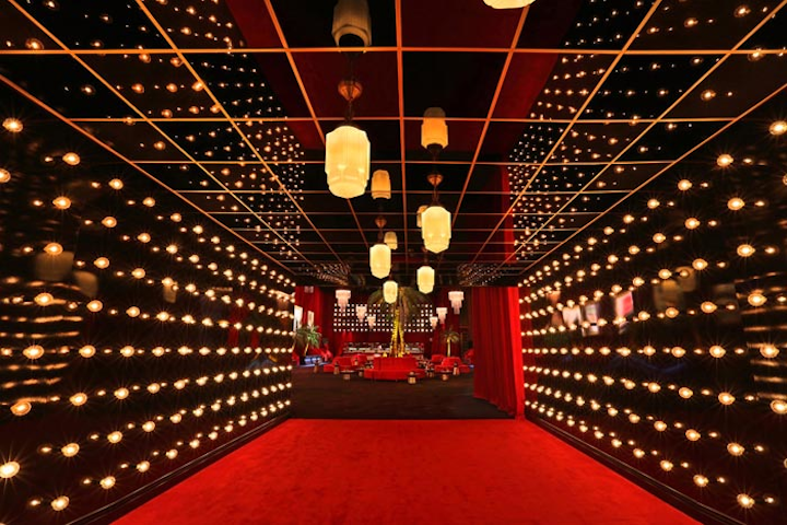 Guests entered through a passageway decorated with theater-style lighting.
