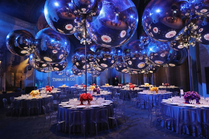 Tiffany & Company's Blue Book gala took place April 15 at the Cunard Building in New York. The event featured more than three-dozen silver spheres that hung throughout the dinner tables. The spheres were inspired by the bib necklace actress Jessica Biel wore to the gala.