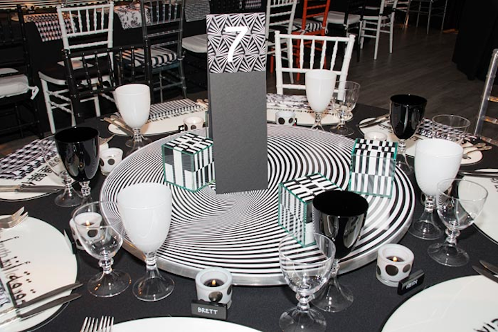 The event had a black-and-white theme that included dominos and playing cards as table decor.