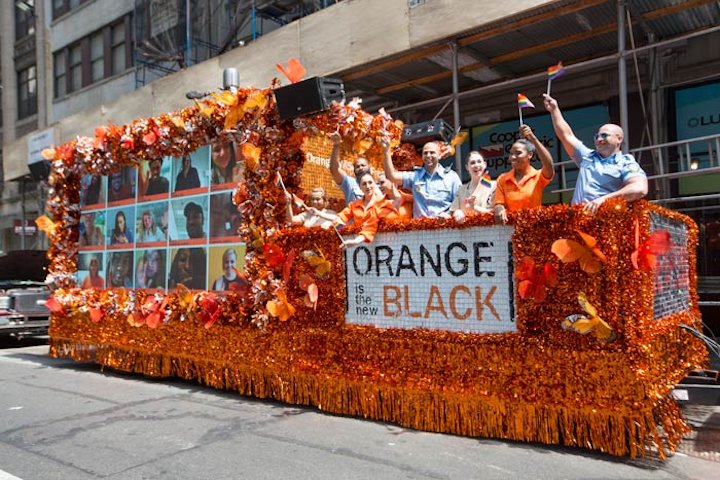 At the Pride parade in Manhattan on June 26, Netflix's prison-drama series Orange Is the New Black activated a fan-fueled, interactive float with a video wall that had a changing stream of fans who broadcast to (and also watched) the parade through a mobile device or desktop by uploading videos to a custom website. Orange Is the New Black also encouraged fans to take photos and used its own Pride hashtag #OrangeWillSetYouFree on social-media platforms. The float, which was produced for Netflix by Allied Experiential, had a festive orange look and carried members of the cast and staffers dressed in prison-themed garb.