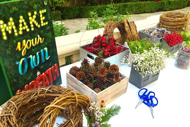 For a family-friendly holiday party at a private home in Los Angeles in December 2015, Seed Floral set up a wreath-making station and make-your-own snow globe and ornament stations.