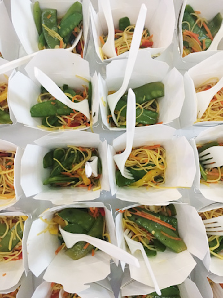 The Smithsonian Air and Space Museum has tight regulations on how branding and sponsorships can be used in its facility, so Hello! DC and Occasions Caterers incorporated the opening-night event’s sponsors into the naming of each dish served throughout the facility. Food stations held a selection of small main dishes like the Airport Chinese Takeout, sponsored by Washington Dulles International Airport.