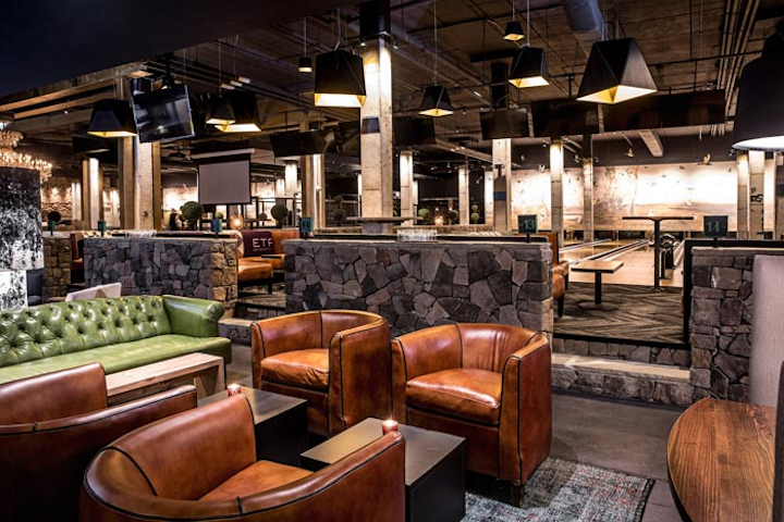The Painted Duck, a duckpin bowling venue, opened in at the Stockyards Atlanta development in December. The basement space, which takes design inspiration from a cavernous ruin and a hunting lodge, has 16 bowling lanes, along with a 50-foot mural depicting ducks, wildlife, and nature created by artist Todd Murphy. The 26,000-square-foot venue is available for buyouts and holds as many as 550 people standing; it can also accommodate semiprivate events for 150 guests.