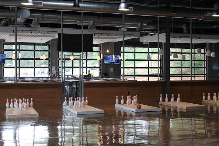 Pin & Proper, a venue that offers “pinfall,” a game that combines football and bowling, opened in Grant Park in August. In addition to space for the game, the venue offers small bites and shared plates of American food, as well as a full bar that includes cocktails created by Rob Floyd, the main bartender on SpikeTV’s Bar Rescue. The venue, which has 8,600 square feet of interior space and 1,200 square feet of outdoor patio space, can seat as many as 375 guests and holds more than 500 guests standing. The space has two V.I.P. lanes with lounge seating to rent for private parties and also offers full and partial buyouts.