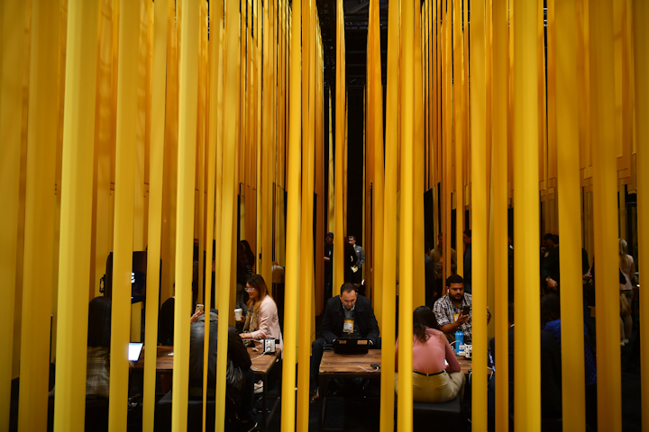 Canadian interbank network Interac featured a lounge created with bands of hanging fabric in the company's shade of yellow. Inside the lounge, tables, chairs, and charging stations were provided for impromptu meetings. In another space, Interac employees gave demos of the brand's technology and services. The lounge was produced by creative agency Zulu Alpha Kilo in partnership with event design and build company Astound. See more: 12 Highlights From the First Collision Tech Conference in Canada