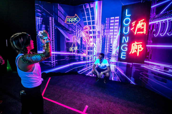 Google Pixel owners and T-Mobile customers were given access to an activation, which housed two spaces: the Pixel Pass Lounge and the Night Sight Experience. The lounge offered charging stations and UV tattoo station, and the Night Sight Experience featured four futuristic, back-lit photo backdrops. Scenes included a neon-industrial cityscape. Google partnered with Live Nation to produce the activation.
