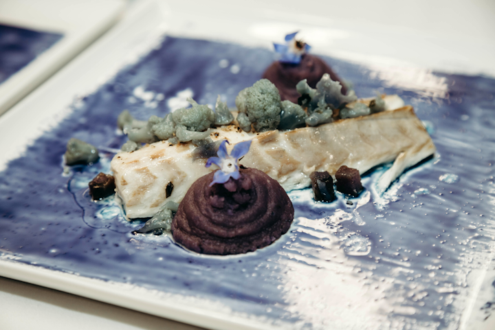 For a sensorial dinner celebrating the launch of the Moroccanoil Color Depositing Mask Collection, chef Bob Spiegel of Pinch Food Design created a branzino dish with blue butterfly tea paint inspired by the hues of the hair products.