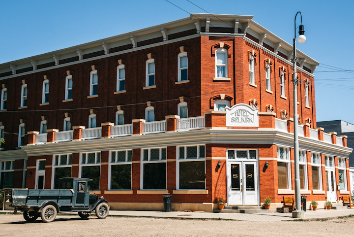 While an extensive, $165 million redevelopment project has closed Fort Edmonton Park for regular admission, 10 unique venues remain open for private events. Three historic churches and the memorial garden are popular sites for weddings, while the Clerk’s Quarters of the Hudson Bay Company’s trading fort or the reproduction Pennsylvania Dutch-style barn are ideal for receptions of as many as 100 people. Larger events can take place in the Capitol Theatre, circa 1929, which seats 5,000 guests, or the Blatchford Field Air Hangar, which holds 600 guests. The property is also home to the Selkirk Hotel, where an expansion will add a new 250-seat ballroom. The park is expected to reopen in its entirety in May 2021, with access to regular features like horse-drawn carriage rides, the midway, and pioneer villages.