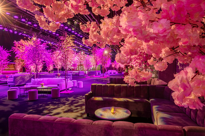 This year's event had a 'cherry blossom forest' theme from producers Event Eleven. Trees featuring various shades of pink blossoms were stationed alongside plush furniture, walnut details, and pops of pink.