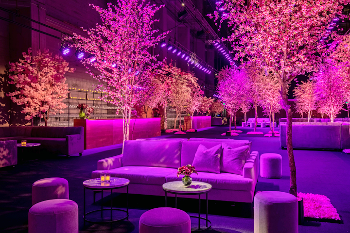 Green Set provided the trees, while Floral Crush Studio handled floral design. Furniture came from Event Eleven and FormDecor, and Images by Lighting handled lighting design.