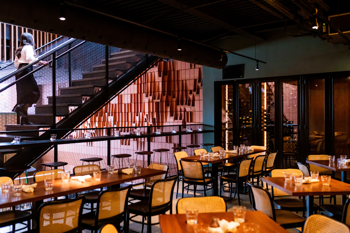 Following the success of its predecessor, Gusto 101, Gusto 501 opened in February and offers five levels of fine dining and 8,000 square feet of space. Working alongside architecture firm Partisans and design agency Wendy Haworth Design Studio, the restaurant uses an all-glass façade covering the restaurant in natural sunlight. On each floor, different experiences are offered, including a semiprivate Amari Lounge with seating for 30, a top-floor chef tasting kitchen aptly named Attico with seating for 24, and an open-concept ground-level dining area with seating for 60. Each space is designed to be bought out individually or together depending on need. Full buyouts are available.