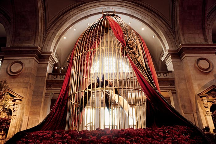 For the museum's 2007 tribute to French couturier Paul Poiret, four peacocks perched in a gilded cage, which was surrounded by more than 12,000 red roses—the designer's personal emblem. In the book's introduction, Vogue editor-in-chief and Condé Nast artistic director Anna Wintour recalls an event planner's nightmare: the pride of peacocks going AWOL in Central Park before the gala. See more: Behind the Scenes at the Met Gala and Its Inspirational Exhibitions