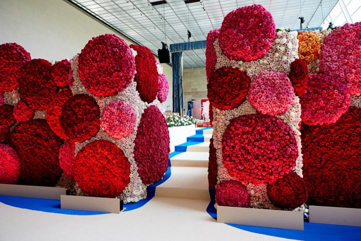 Guests entered the Temple of Dendur for dinner, walking between two walls of off-white flowers covered in 3-D dots made from hot-pink and burgundy roses. A trompe l'oeil royal-blue muslin curtain, highlighted in gold, draped the stage where a performance by Katy Perry would later take place. See more: Met Gala 2017: Inside the Yearlong Process of Designing Fashion’s Biggest Night