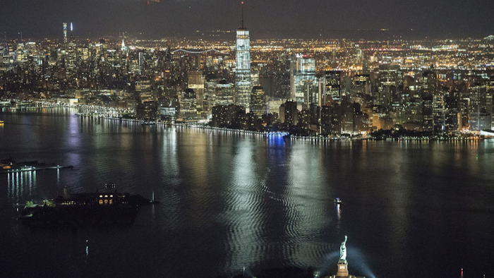 The solar-powered airplane on a globe-circling voyage that began more than a year ago in the United Arab Emirates reached a milestone Saturday, completing a trip across the United States with a Statue of Liberty fly-by before landing in New York. (Jean Revillard/ SI2 via AP)