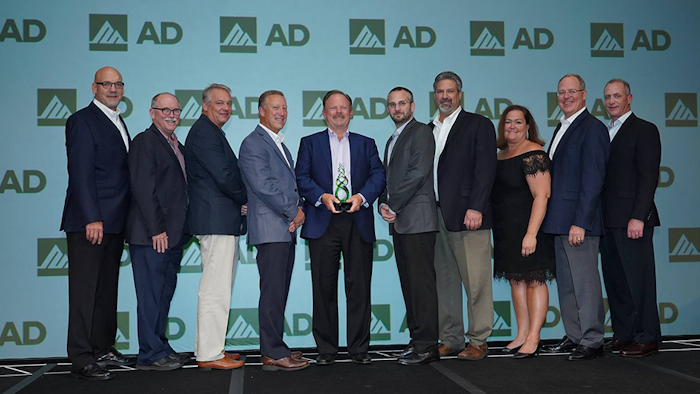 John Wiborg (center) and members of Stellar Industrial Supply accept AD Industrial's first ever Best Workplace Award at the AD Industrial North American meeting in Grapevine, TX. (AD photo)