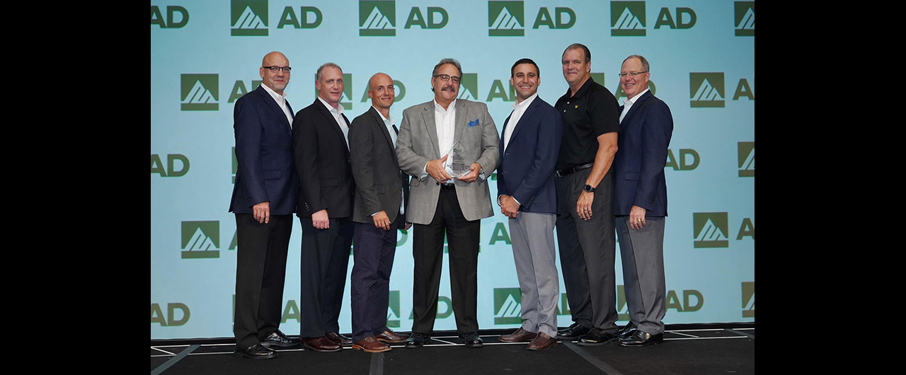 Members of All Integrated Solutions, Sia Abrasives and CribMaster accept AD Industrial's award for Best Conversion for MRO.