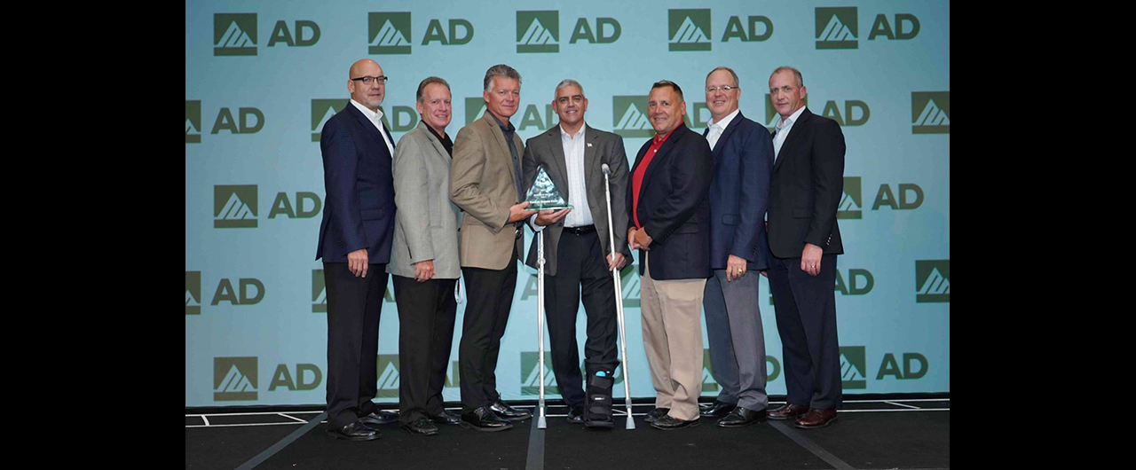 Members of Tingley Rubber accept AD Industrial's asward for Tier 1 Supplier of the Year.