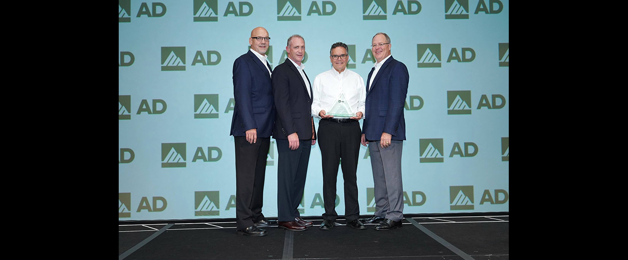 Weber Supply's Dan Amatruda accepts AD Industrial's award for Member of the Year for Leadership.