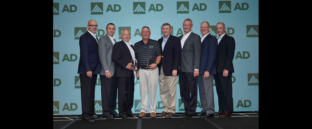 Members of DormerPramet and Sterling Supply accept AD Industrial's award for Best Conversion for Metalworking.