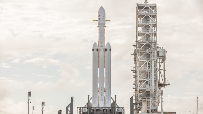 This Dec. 28, 2017 photo made available by SpaceX shows a Falcon Heavy rocket at Cape Canaveral, Fla. On Wednesday, Jan. 24, 2018, the rocket's three boosters — 27 engines in all — were tested. SpaceX is aiming for a February launch. (SpaceX via AP)