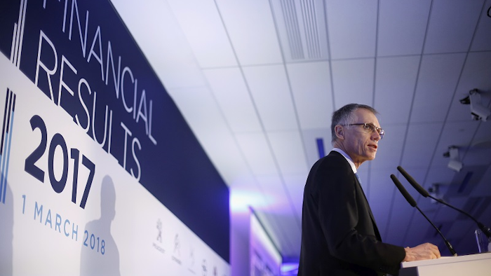 PSA Peugeot Citroen CEO Carlos Tavares, left, and PSA Peugeot Citroen CFO and member of the managing board Jean-Baptiste Chasseloup de Chatillon, right, pose for photographers prior to the presentation of the company's 2017 full year results, in Rueil- Malmaison, west of Paris, Thursday, March 1, 2018. Image credit: AP Photo/Thibault Camus