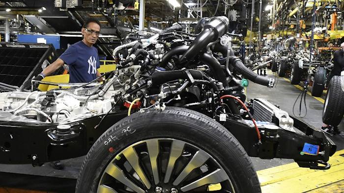 In this Oct. 27, 2017, photo, workers assemble Ford trucks at the Ford Kentucky Truck Plant in Louisville, Ky. Image credit: AP Photo/Timothy D. Easley
