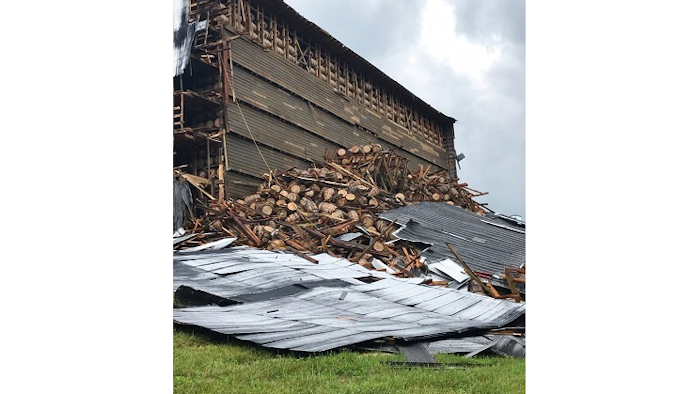 In this image provided by the Bardstown, Ky., Fire Department, debris is piled in a heap after a section of a bourbon storage warehouse at the Barton 1792 Distillery collapsed, Friday June 22, 2018, in Bardstown, Ky. Nelson County Emergency Management spokesman Milt Spalding says about 9,000 barrels filled with aging bourbon were affected.