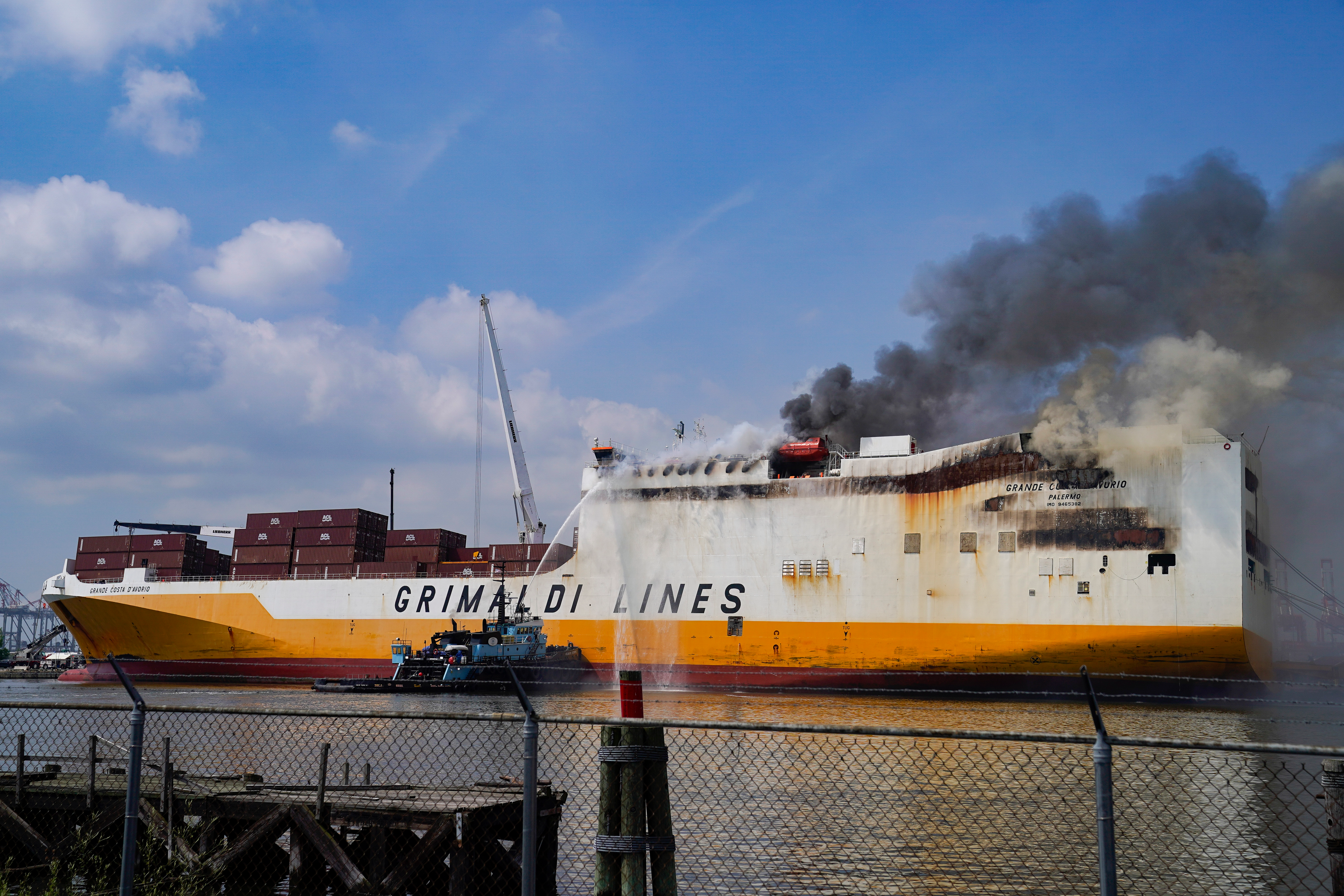Emergency personnel battle against a fire aboard the Italian-flagged Grande Costa d'Avorio cargo ship at the Port of Newark, Friday, July 7, 2023, in Newark, N.J.