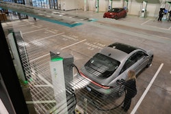 A car gets charged at the new Electrify America indoor electric vehicle charging station during a preview in San Francisco, Wednesday, Feb. 7, 2024.