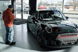 A man looks at a 2024 Cooper S John Cooper Works convertible at a Mini dealership on Nov. 30, 2023, in Loveland, Colo.