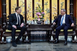 In this photo released by Xinhua News Agency, visiting Tesla founder and CEO Elon Musk, left, meets with Chinese Premier Li Qiang in Beijing, Sunday, April 28, 2024. Musk met with a top government leader in the Chinese capital Sunday, just as the nation's carmakers are showing off their latest electric vehicle models at the Beijing auto show.