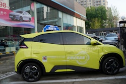 A Seagull electric vehicle from Chinese automaker BYD for test driving is parked outside a showroom in Beijing, Wednesday, April 10, 2024.