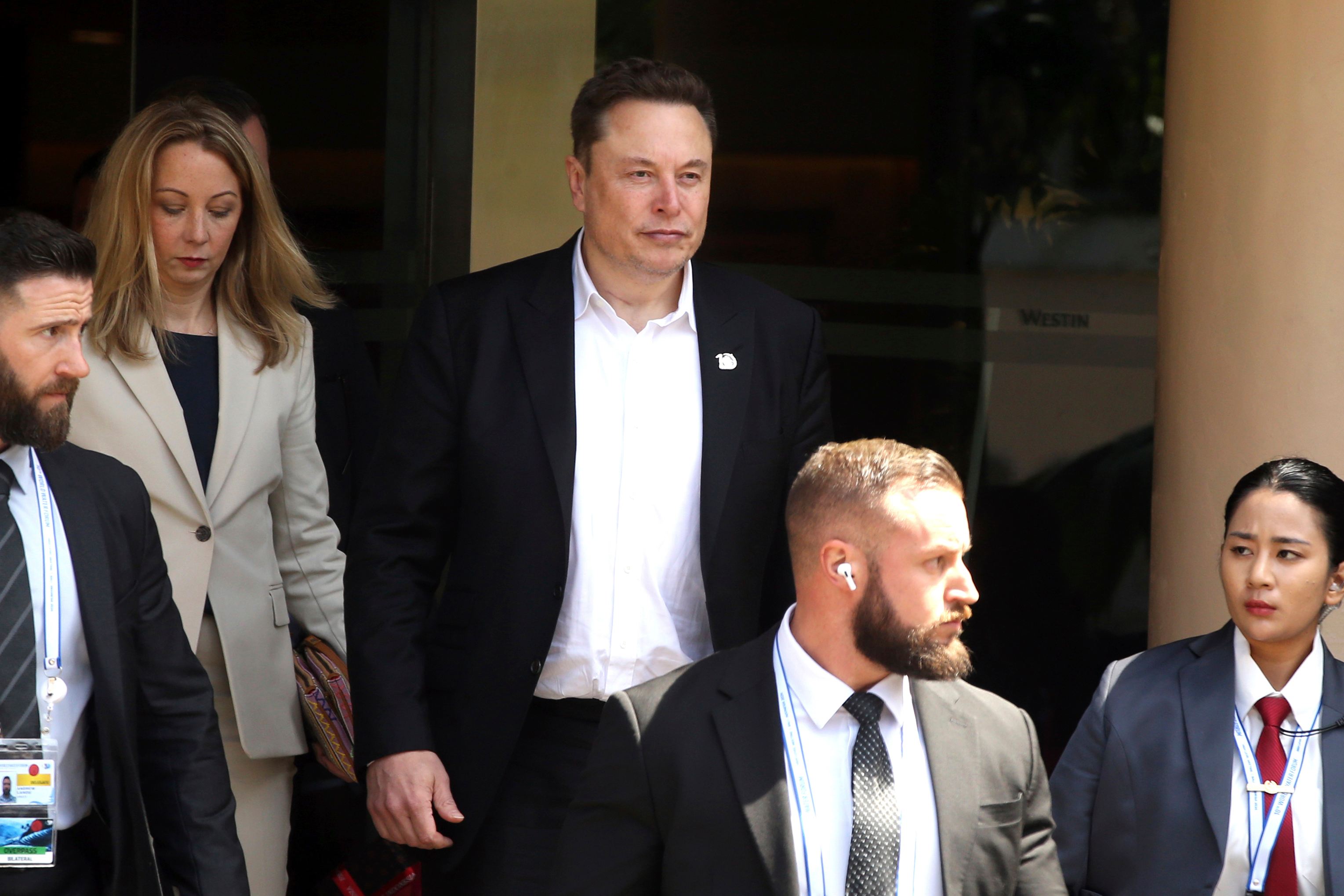 Elon Musk, center, arrives for the 10th World Water Forum in Nusa Dua, Bali, Indonesia on Monday, May 20, 2024.