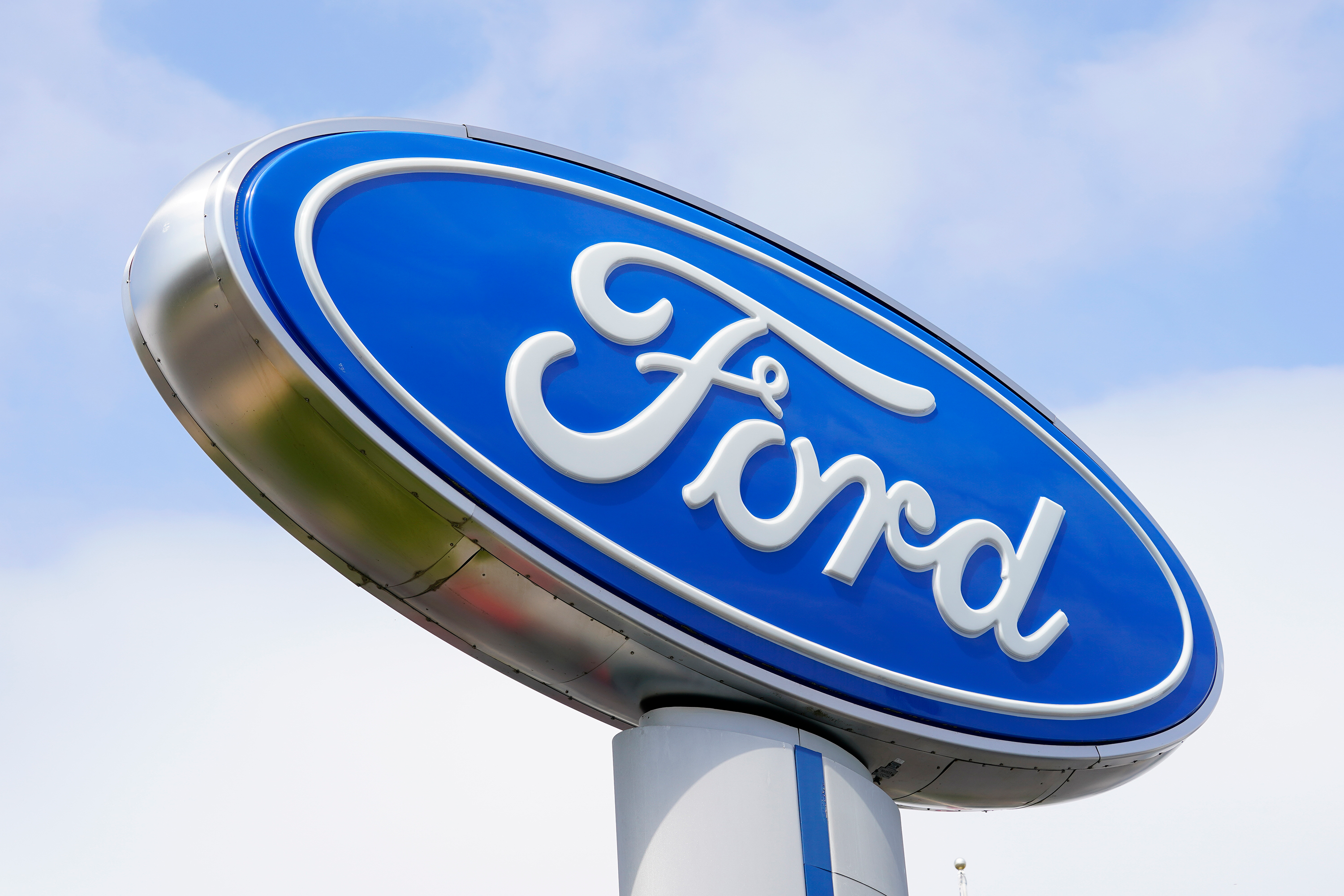 A Ford sign is shown at a dealership in Springfield, Pa., Tuesday, April 26, 2022.