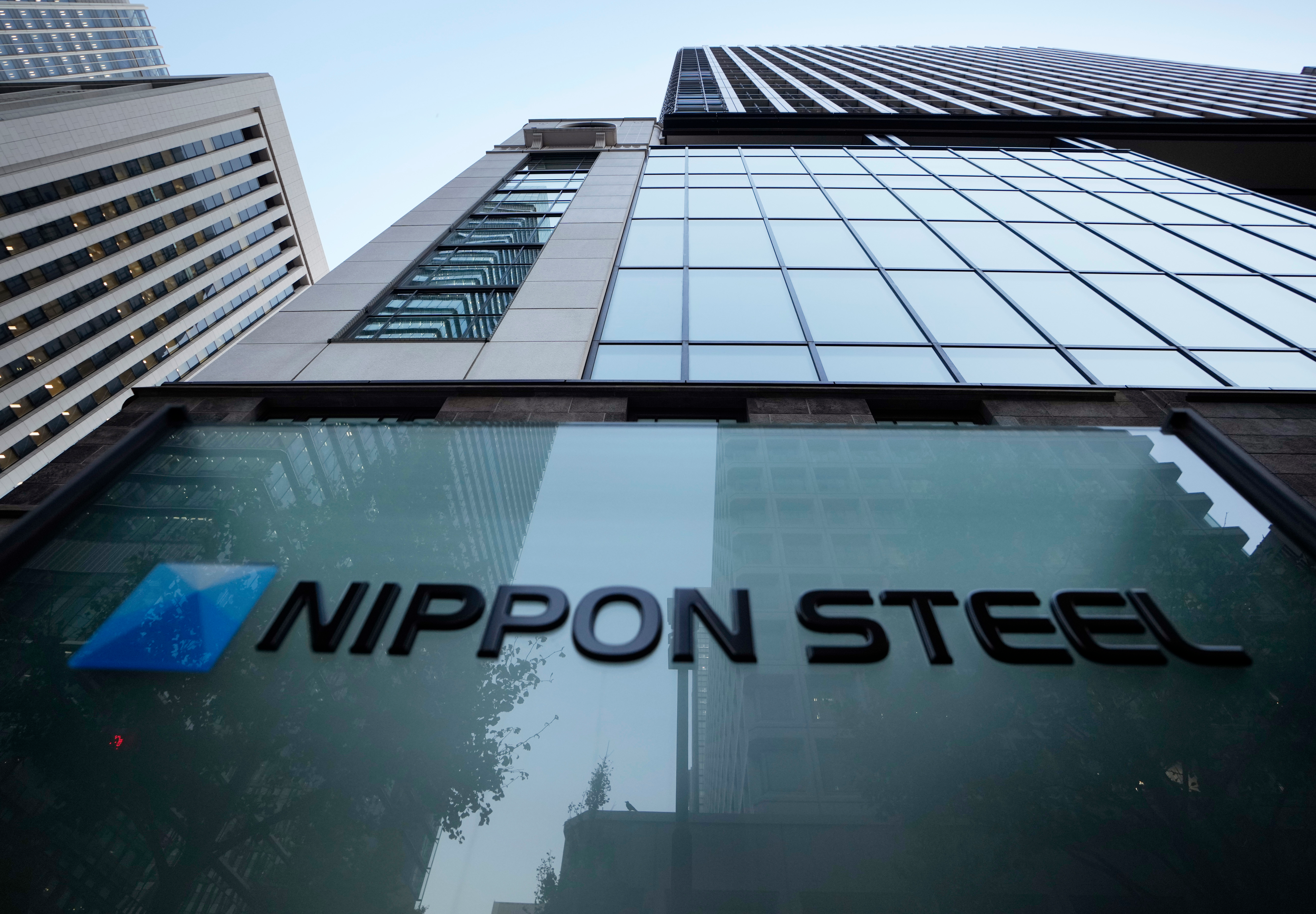 Nippon Steel Corporation's logo is displayed on a sign outside its headquarters in Tokyo on Nov. 26, 2021.