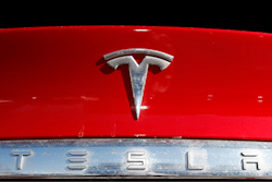 The Tesla logo appears on an unsold 2020 Model X at a dealership, Feb. 2, 2020, in Littleton, Colo.