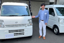 Susumu Miura, a Nissan Research Center manager, shows a Nissan car that is coated with the special “cool paint,” under testing at Tokyo’s Haneda airport.