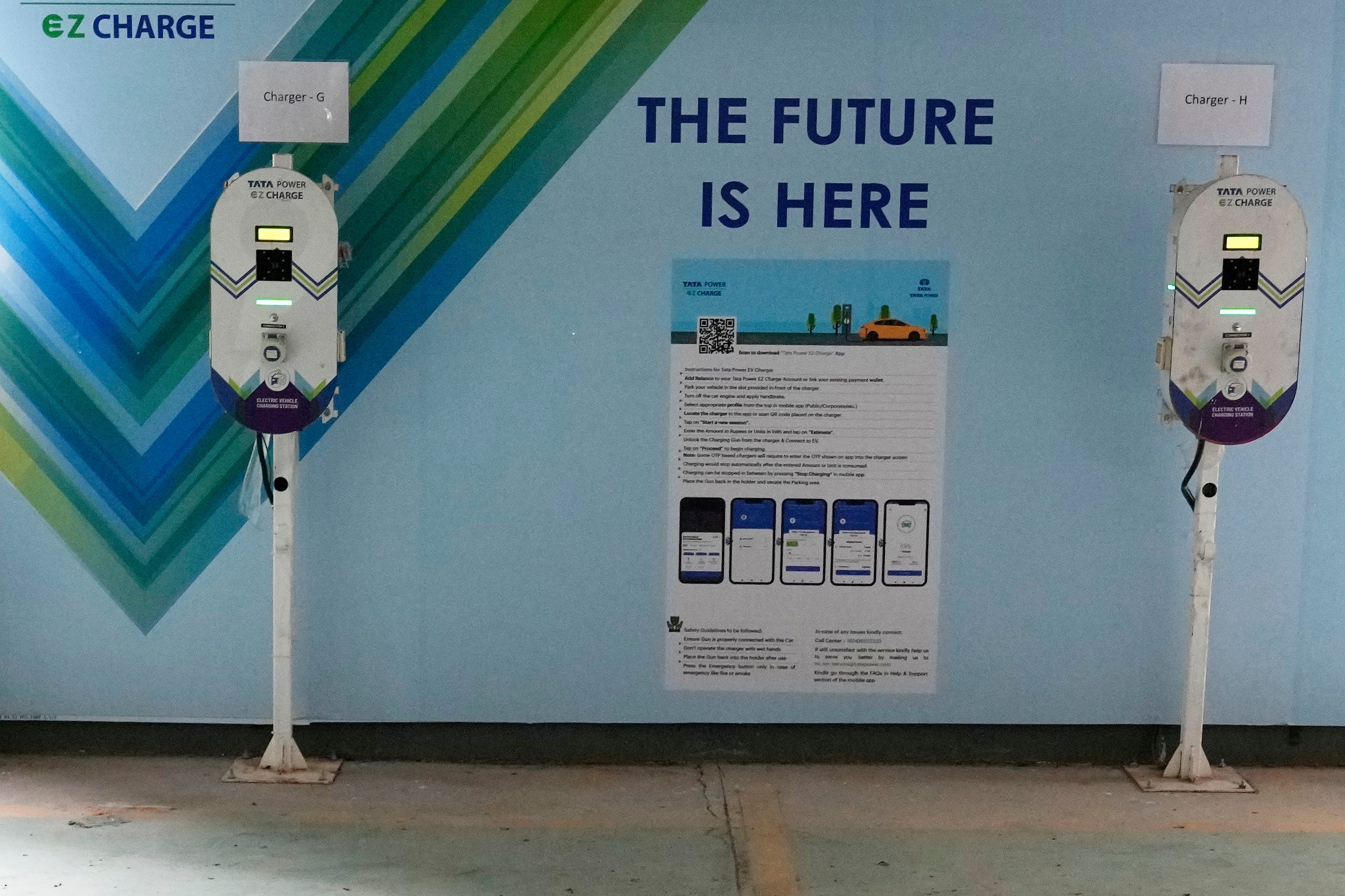 Electric Vehicle charging stations are seen a residential building parking area in Mumbai, India.