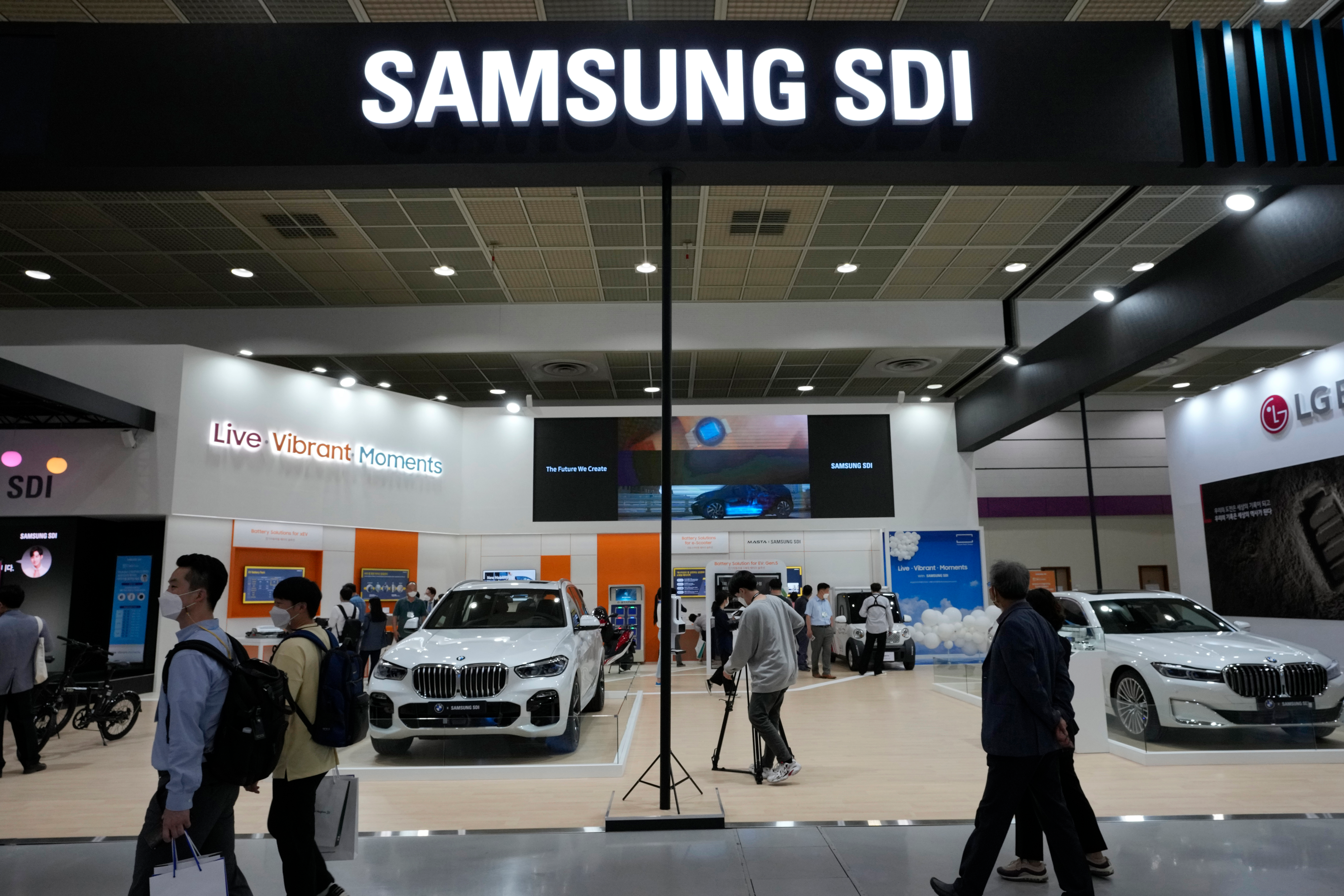 People walk by Samsung SDI Co.' booth during the InterBattery 2021, the country's leading battery exhibition, at COEX in Seoul, South Korea, on June 9, 2021.