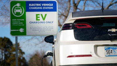 A Chevrolet Volt charges at at a station outside the Denver Museum of Nature and Science Tuesday, Jan. 5, 2020, in east Denver.