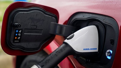 A 2023 Ford Mustang Mach-E charges, Friday, March 8, 2024, at an electric vehicle charging station in London, Ohio.