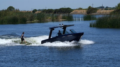 Grant Jeide wake surfs behind an electric sports boat made by California-based Arc Boats on the Sacramento-San Joaquin Delta near Bethel Island, Calif. on Wednesday, July 31, 2024.