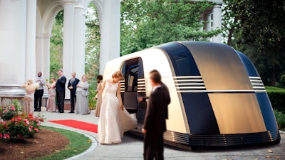 In this rendering, a bride arrives to her wedding in a Robovan.