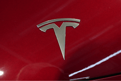 The logo of Tesla car is pictured at the Paris Auto Show, in Paris, Monday, Oct. 14, 2024.