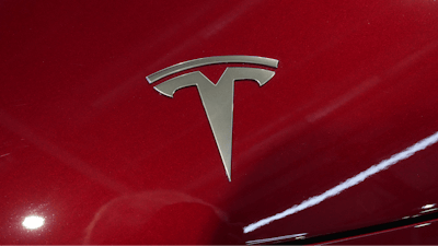 The logo of Tesla car is pictured at the Paris Auto Show, in Paris, Monday, Oct. 14, 2024.